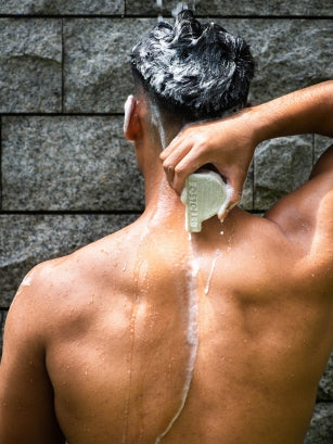 man with Java Jungle Head to Toe Cleansing Bar in shower