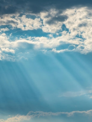 sunshine rays peering over the clouds