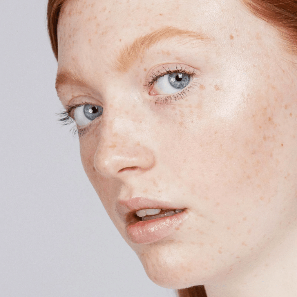 woman with fair skin tone wearing Out of Office Lip-to-Lid Balmies