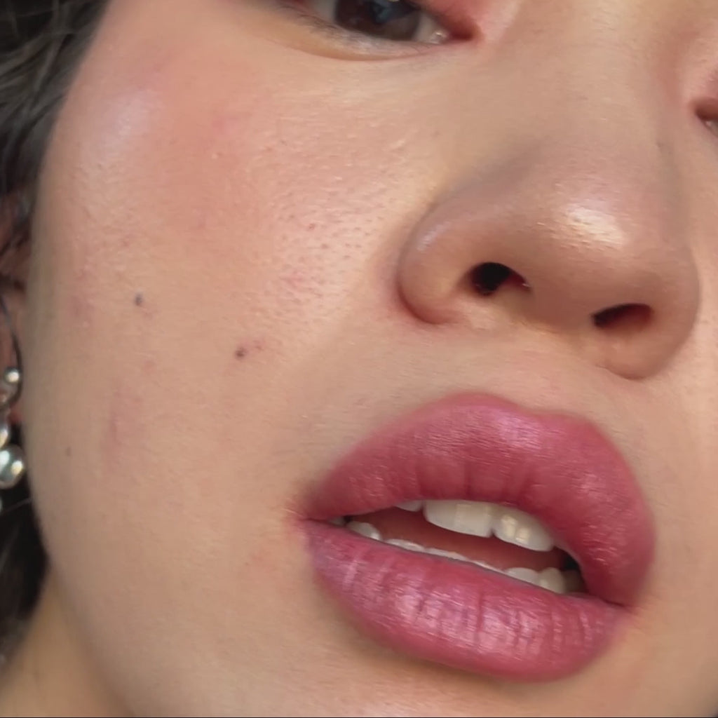 woman with light skin tone applying Rose Lip-to-Lid Balmie