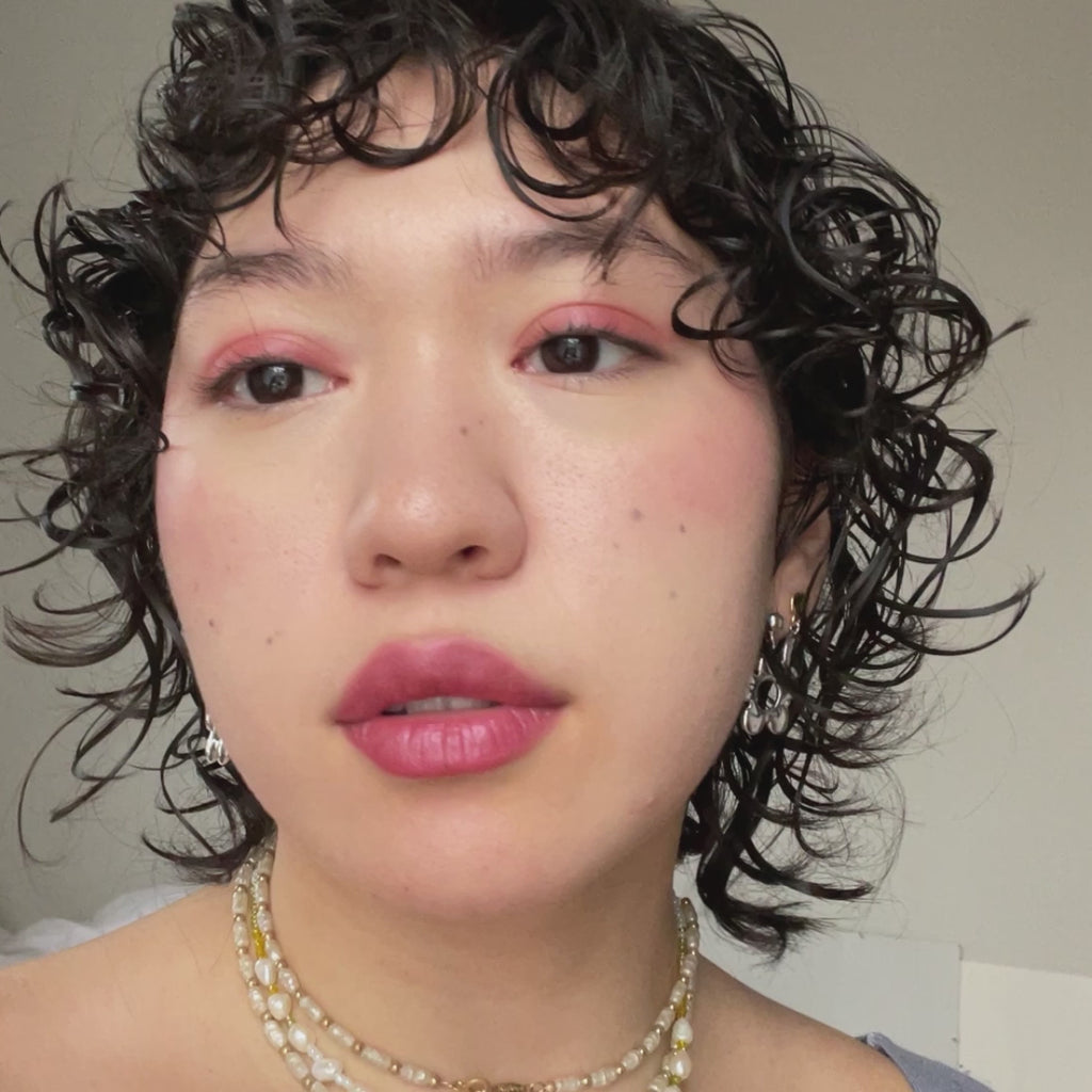 woman with light skin tone wearing Nude Plum + Rose Lip-to-Lid Balmie