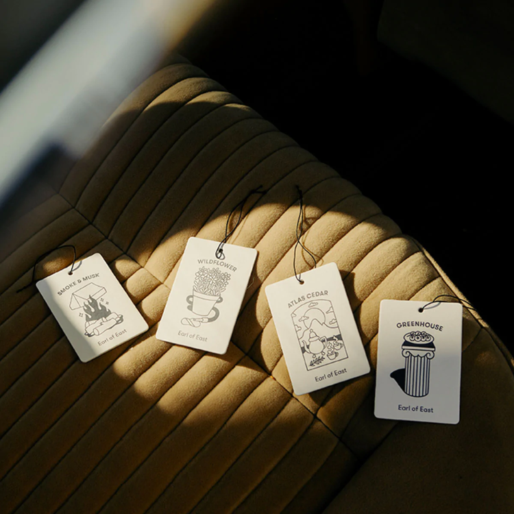 Earl of East Air Fresheners on the car seat