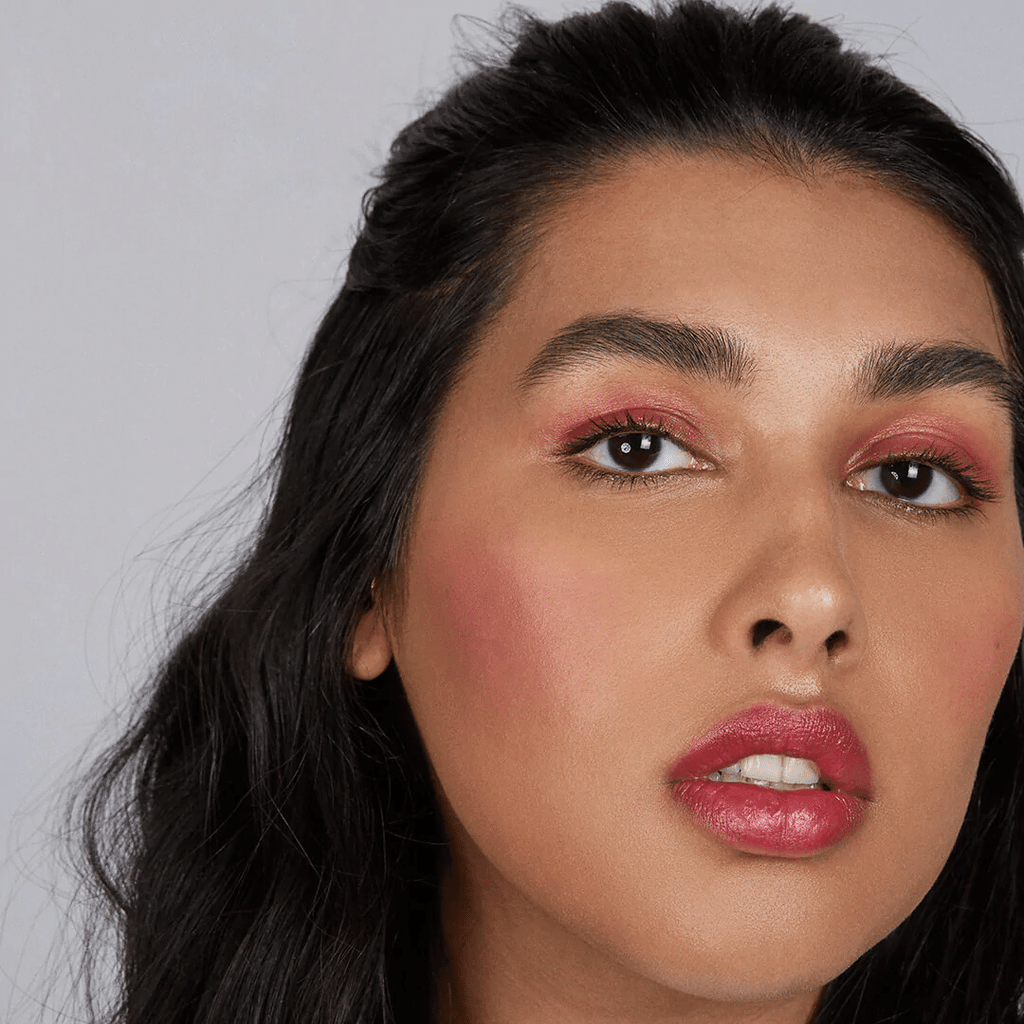 woman with medium skin tone wearing Raspberry Lip-to-Lid Balmie