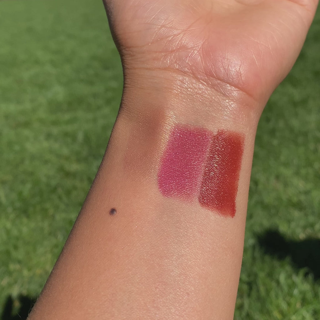 applying swatches of Golden Hour Lip-to-Lid Balmies on wrist