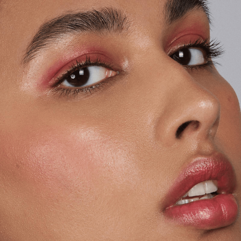 woman with medium skin tone wearing Out of Office Lip-to-Lid Balmies 