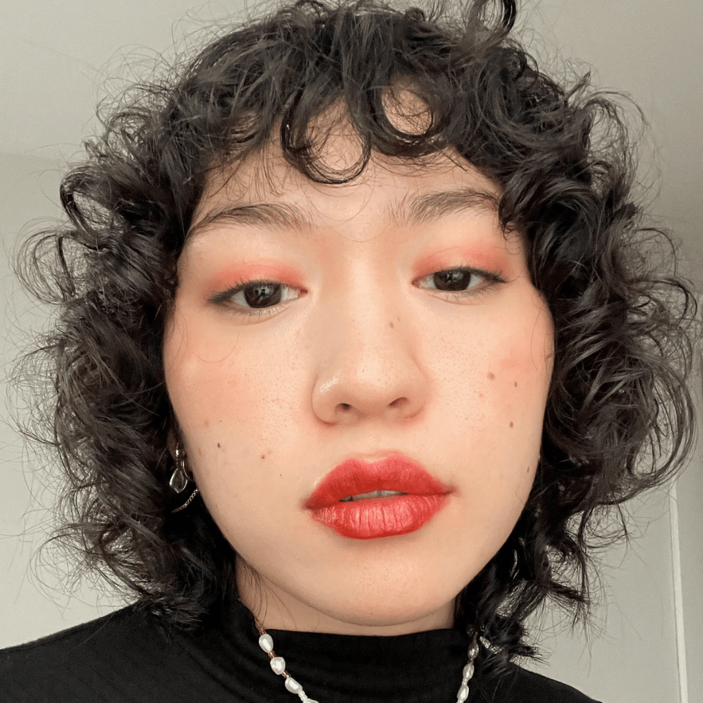 woman with light skin tone wearing Strawberry Lip-to-Lid Balmie