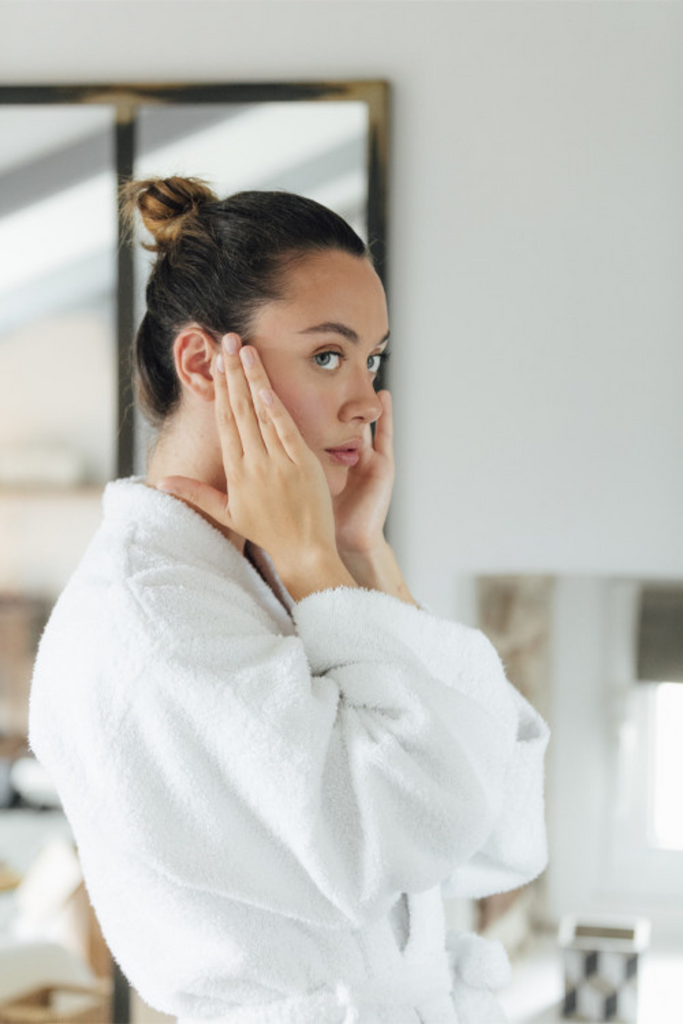 woman applying Organic Regenerative Night Facial Cream