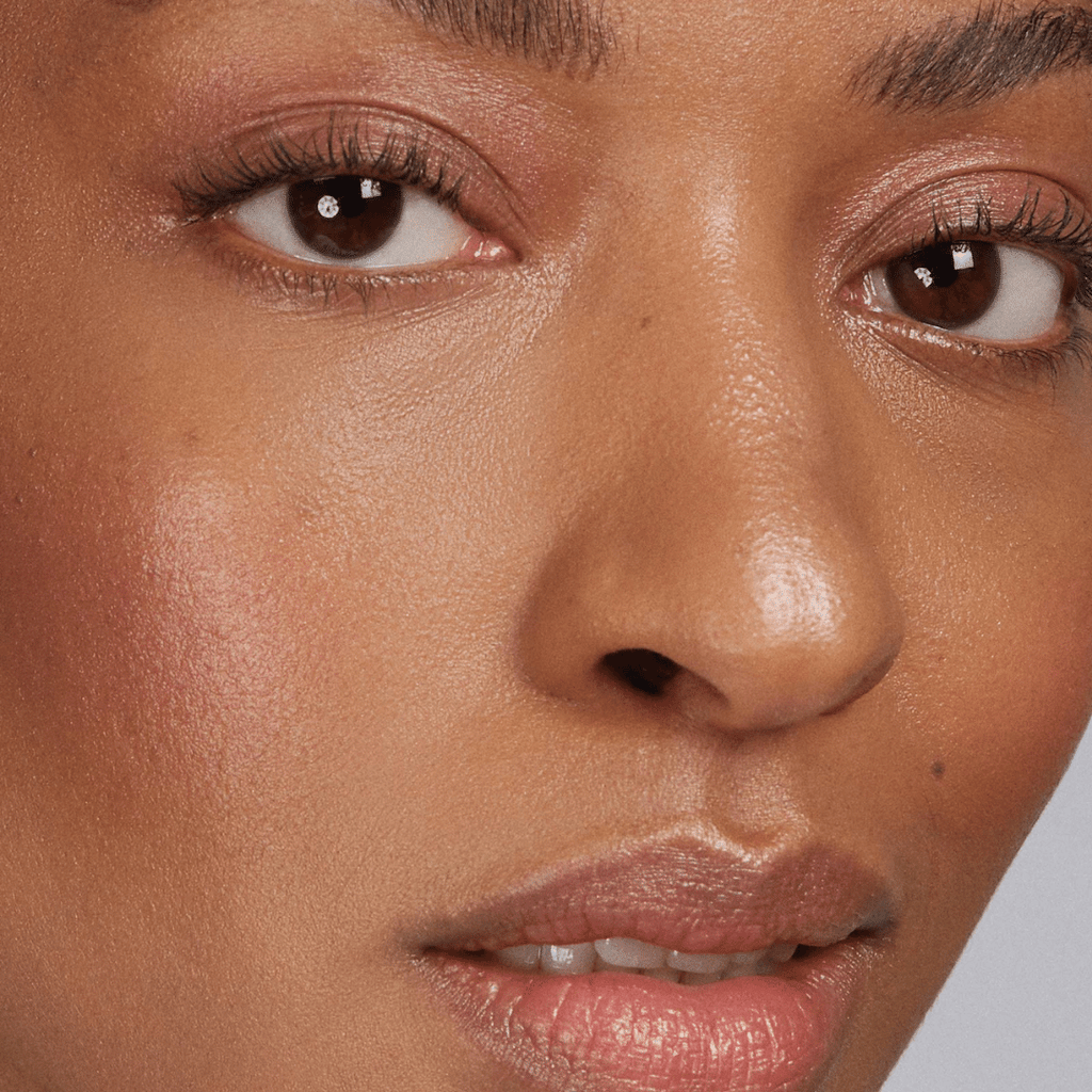 woman with dark skin tone wearing Rose Lip-to-Lid Balmie