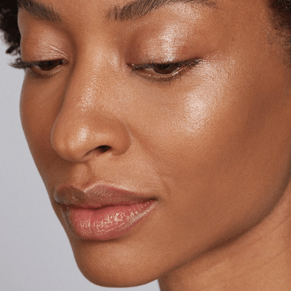 woman with dark skin tone wearing Caramel Lip-to-Lid Balmie