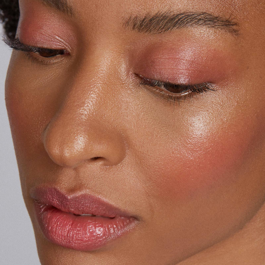 woman with dark skin tone wearing Watermelon Lip-to-Lid Balmie