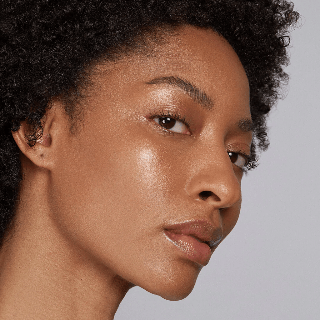 woman with dark skin tone wearing Chestnut Lip-to-Lid Balmie