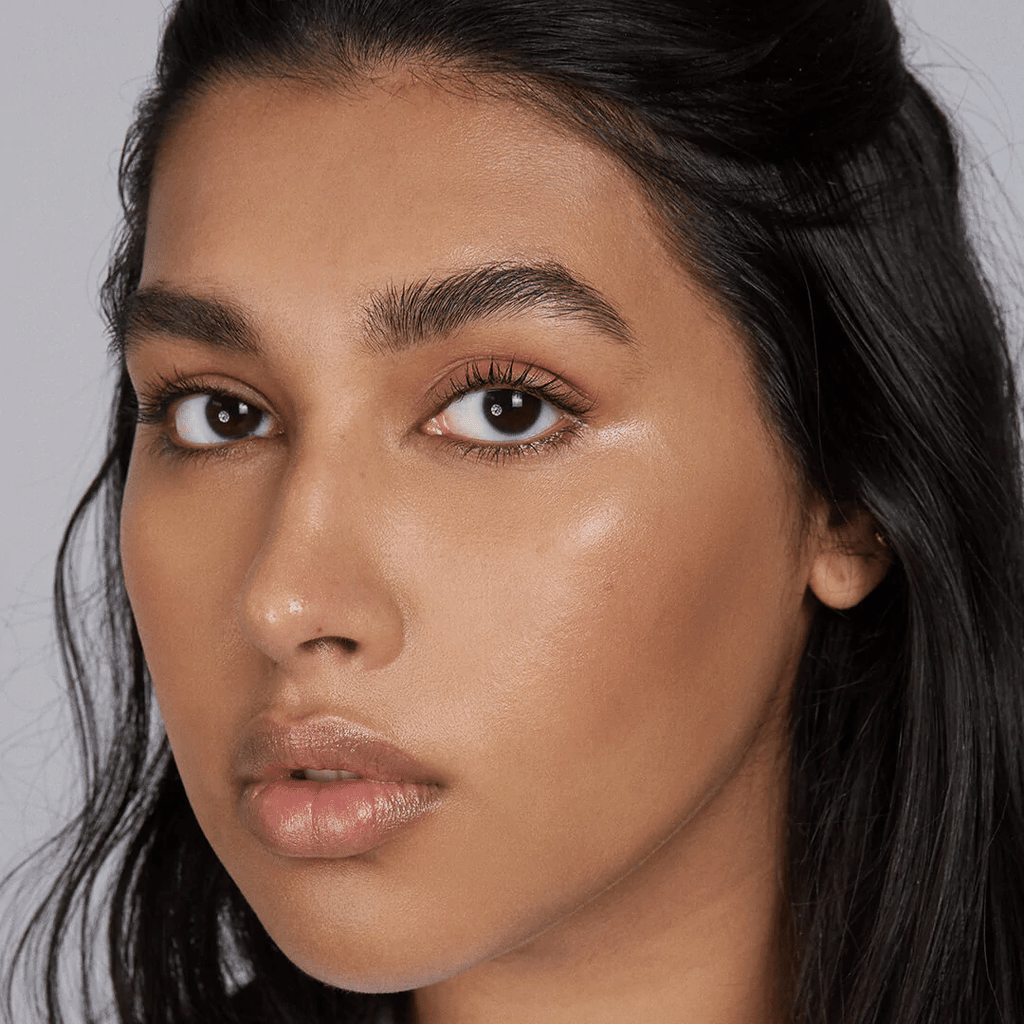 woman with medium skin tone wearing Clementine Lip-to-Lid Balmie