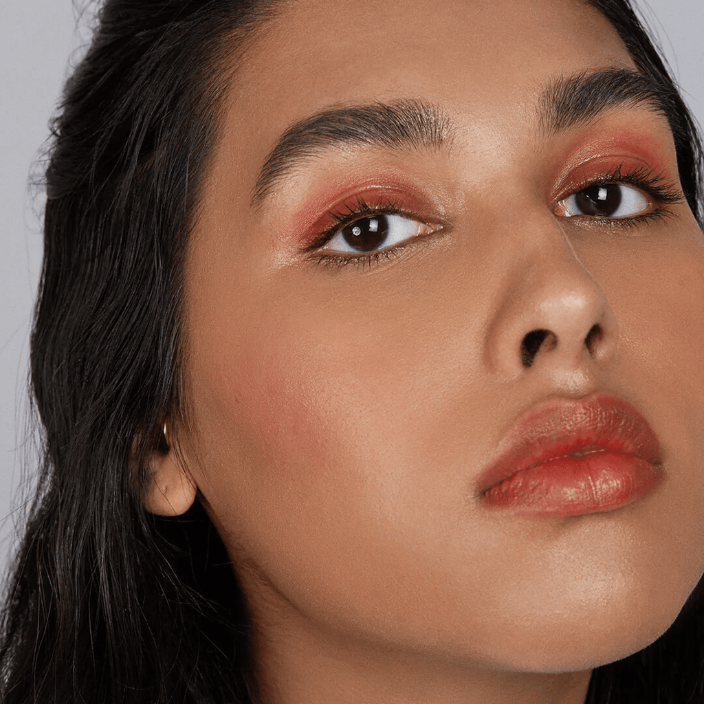 woman with medium skin tone wearing Strawberry Lip-to-Lid Balmie