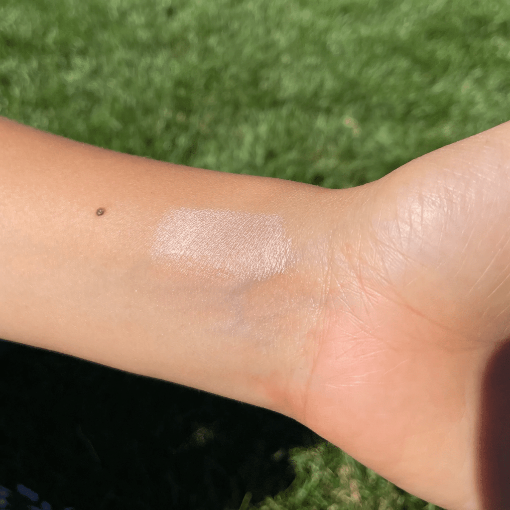 Champagne Lip-to-Lid Balmie swatches on wrist