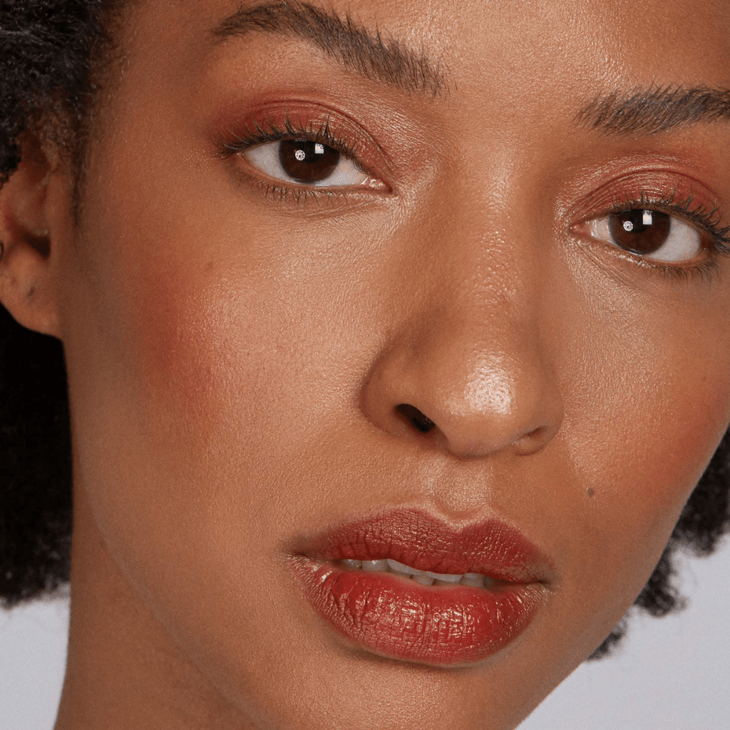 woman with dark skin with Cherry Lip-to-Lid Balmie