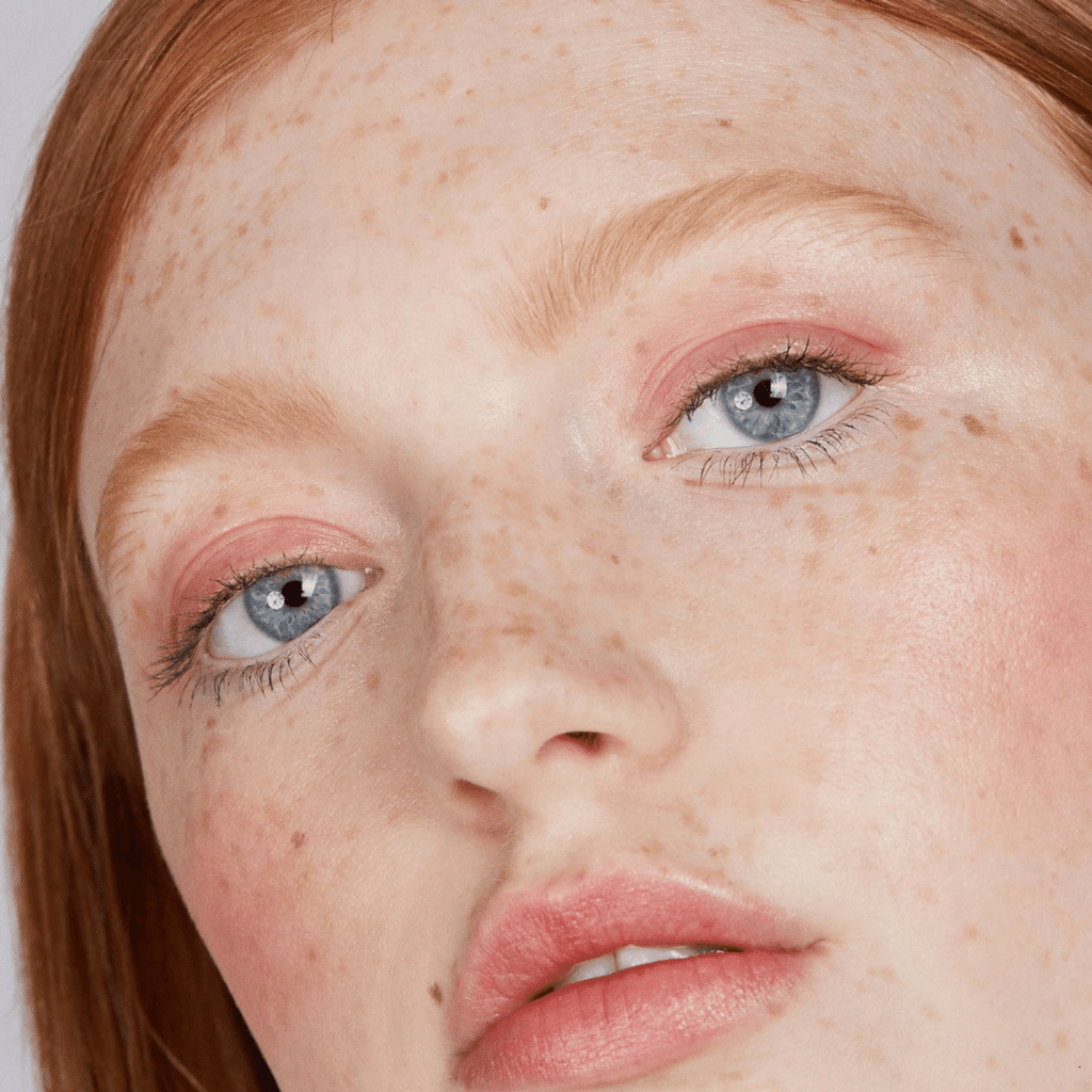 woman with fair skin tone wearing Of the Earth Lip-to-Lid Balmies