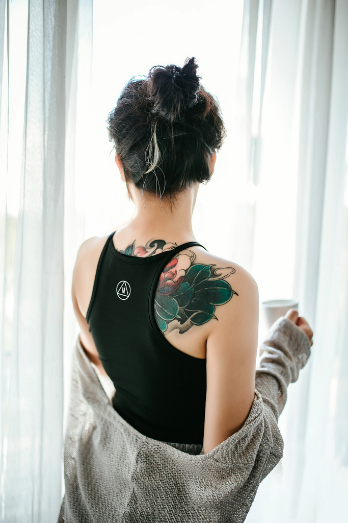 woman with tattoo who used tattoo aftercare cream